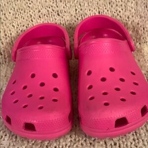 Women’s pink CROCS size 6.